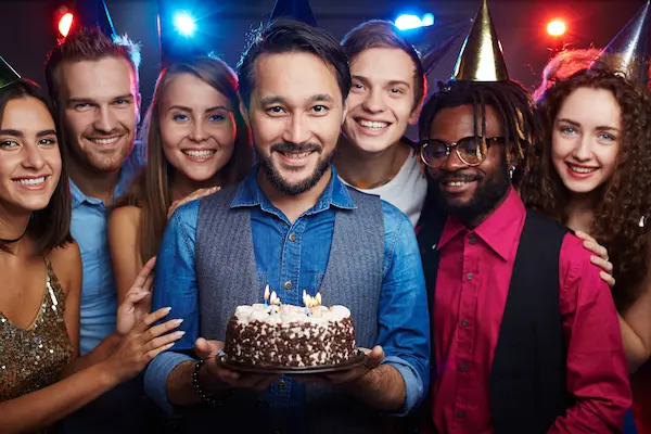 Adults enjoying premium bowling lanes and cocktails